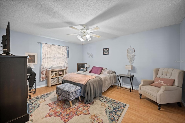 152 Fenimore Ln Unit A & B, Palm Coast, FL 32137 - bedroom with wood finished floors, a textured ceiling, and ceiling fan