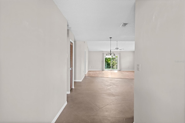 152 Fenimore Ln Unit A & B, Palm Coast, FL 32137 - hall with finished concrete floors and a chandelier