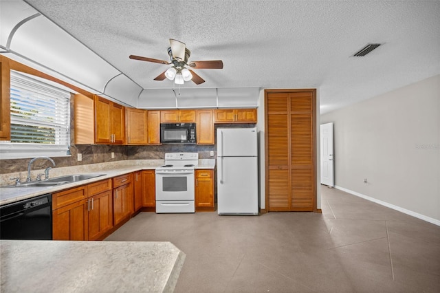 152 Fenimore Ln Unit A & B, Palm Coast, FL 32137 - kitchen featuring black appliances, ceiling fan, a textured ceiling, decorative backsplash, and light countertops