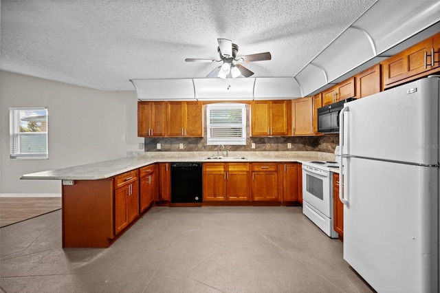 152 Fenimore Ln Unit A & B, Palm Coast, FL 32137 - kitchen with black appliances, a peninsula, brown cabinetry, light countertops, and a ceiling fan