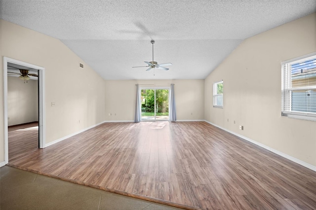 152 Fenimore Ln Unit A & B, Palm Coast, FL 32137 - unfurnished room with ceiling fan, vaulted ceiling, a textured ceiling, and wood finished floors