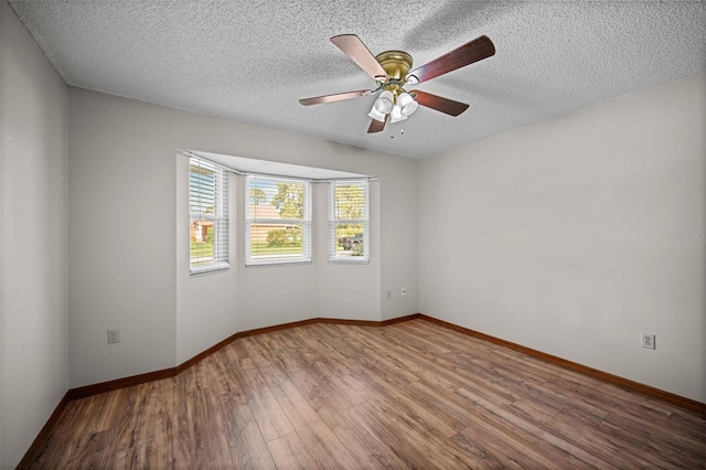 152 Fenimore Ln Unit A & B, Palm Coast, FL 32137 - unfurnished room with wood finished floors, ceiling fan, and a textured ceiling
