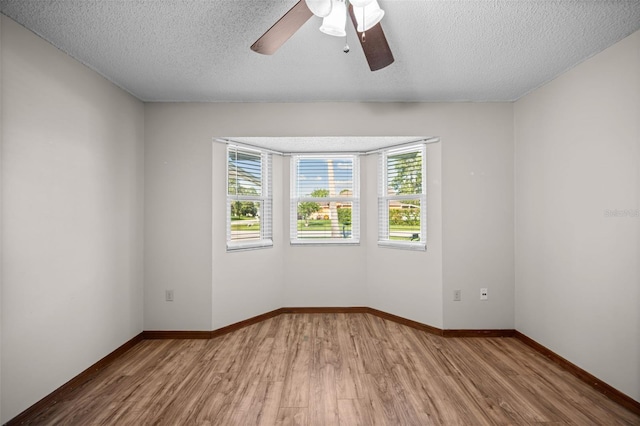 152 Fenimore Ln Unit A & B, Palm Coast, FL 32137 - empty room with wood finished floors, ceiling fan, and a textured ceiling