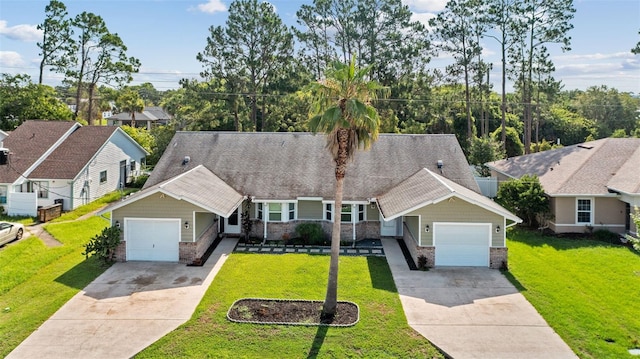 152 Fenimore Ln Unit A & B, Palm Coast, FL 32137 - view of front facade with driveway, a garage, brick siding, and a front lawn