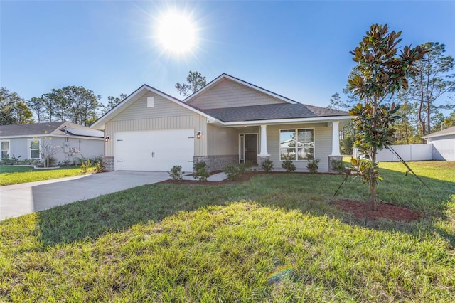 6 Bainbridge Ln, Palm Coast, FL 32137 - view of front of home featuring concrete driveway, an attached garage, brick siding, a shingled roof, and covered porch
