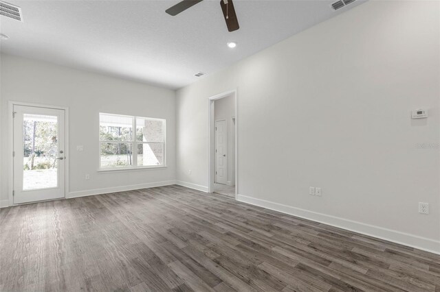 6 Bainbridge Ln, Palm Coast, FL 32137 - spare room with ceiling fan, dark wood-style flooring, and recessed lighting