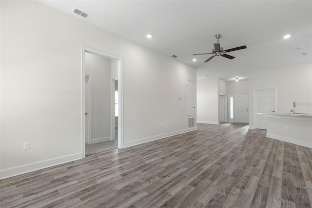 6 Bainbridge Ln, Palm Coast, FL 32137 - unfurnished living room with wood finished floors, recessed lighting, and a ceiling fan