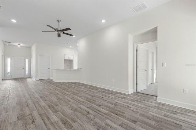 6 Bainbridge Ln, Palm Coast, FL 32137 - unfurnished living room featuring ceiling fan, light wood-type flooring, and recessed lighting