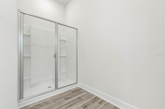 6 Bainbridge Ln, Palm Coast, FL 32137 - full bathroom featuring wood finished floors and a stall shower