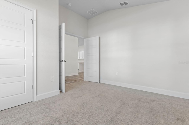 6 Bainbridge Ln, Palm Coast, FL 32137 - unfurnished bedroom with carpet floors and lofted ceiling
