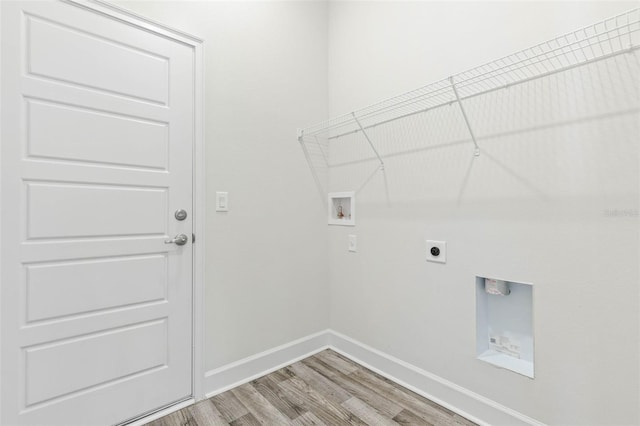 6 Bainbridge Ln, Palm Coast, FL 32137 - laundry area with washer hookup, light wood finished floors, and electric dryer hookup