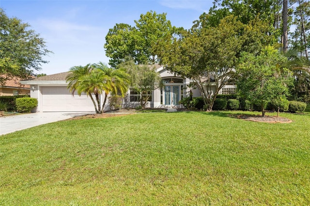 81 Brownstone Ln, Palm Coast, FL 32137 - obstructed view of property with concrete driveway, a front lawn, a garage, and stucco siding