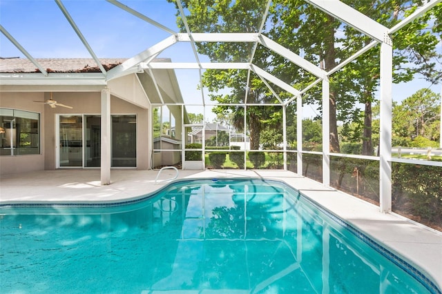81 Brownstone Ln, Palm Coast, FL 32137 - swimming pool with a patio area, a ceiling fan, and glass enclosure