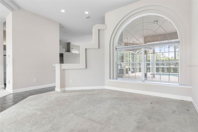 81 Brownstone Ln, Palm Coast, FL 32137 - unfurnished living room with healthy amount of natural light, recessed lighting, and carpet floors
