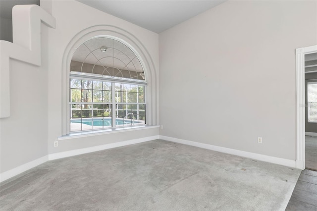 81 Brownstone Ln, Palm Coast, FL 32137 - empty room with baseboards and carpet floors