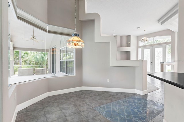 81 Brownstone Ln, Palm Coast, FL 32137 - kitchen featuring a chandelier, a ceiling fan, pendant lighting, and tile patterned flooring