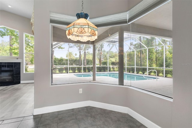81 Brownstone Ln, Palm Coast, FL 32137 - unfurnished sunroom with a swimming pool, plenty of natural light, and vaulted ceiling