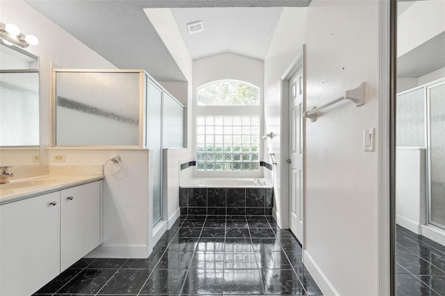 81 Brownstone Ln, Palm Coast, FL 32137 - bathroom featuring vanity, a garden tub, a shower stall, vaulted ceiling, and marble finish flooring