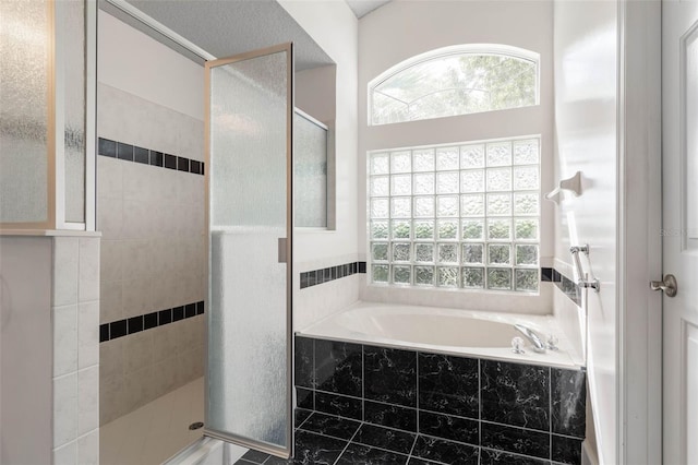 81 Brownstone Ln, Palm Coast, FL 32137 - bathroom with a bath and a stall shower