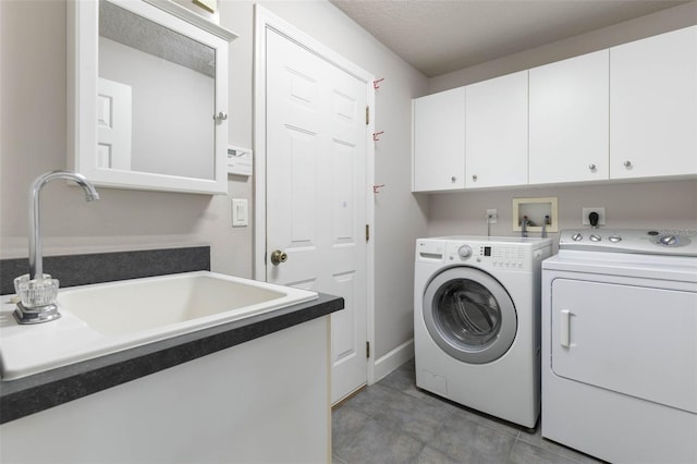 81 Brownstone Ln, Palm Coast, FL 32137 - washroom with cabinet space, washer and dryer, and light tile patterned floors