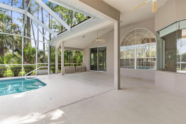 81 Brownstone Ln, Palm Coast, FL 32137 - swimming pool featuring ceiling fan, a patio, and glass enclosure