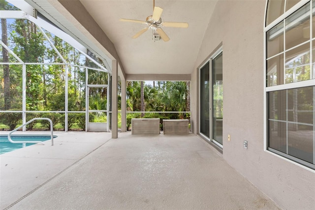 81 Brownstone Ln, Palm Coast, FL 32137 - unfurnished sunroom with a ceiling fan, healthy amount of natural light, and lofted ceiling