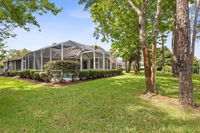 81 Brownstone Ln, Palm Coast, FL 32137 - view of grassy yard featuring a lanai