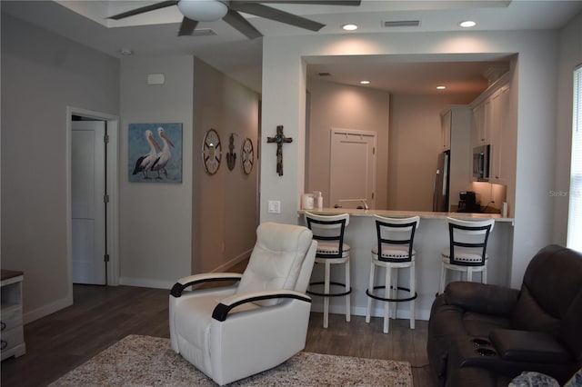146 Via Madrid Dr, Ormond Beach, FL 32176 - living area featuring dark wood-style flooring, ceiling fan, and recessed lighting