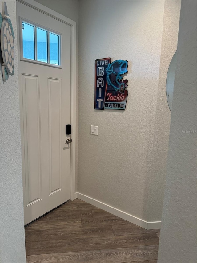 146 Via Madrid Dr, Ormond Beach, FL 32176 - foyer featuring dark wood-style floors and a textured wall