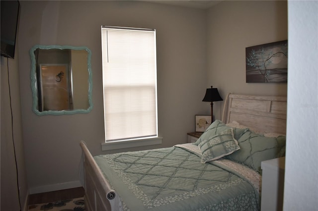 146 Via Madrid Dr, Ormond Beach, FL 32176 - bedroom featuring multiple windows and wood finished floors