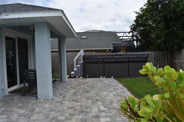 146 Via Madrid Dr, Ormond Beach, FL 32176 - fenced backyard featuring a patio area and a hot tub