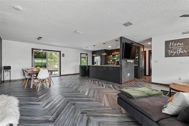 8 White Horse Ln, Palm Coast, FL 32164 - living room with baseboards and a textured ceiling
