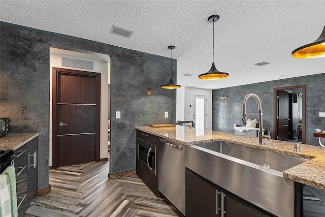 8 White Horse Ln, Palm Coast, FL 32164 - kitchen featuring dishwasher, a textured ceiling, light stone counters, pendant lighting, and gas stove