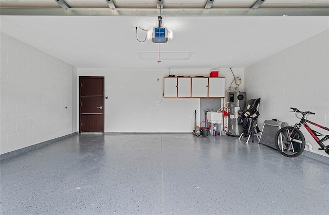 8 White Horse Ln, Palm Coast, FL 32164 - garage featuring water heater, a garage door opener, and concrete block wall
