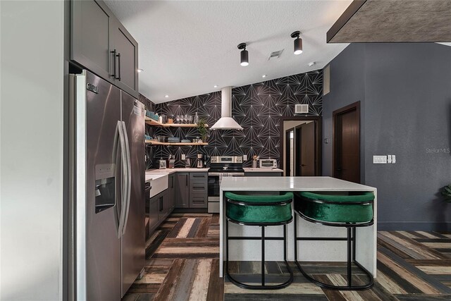 66 Randolph Dr, Palm Coast, FL 32164 - kitchen featuring stainless steel appliances, light countertops, open shelves, a center island, and gray cabinets
