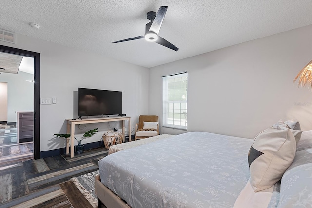 66 Randolph Dr, Palm Coast, FL 32164 - bedroom with a textured ceiling, ceiling fan, and wood finished floors