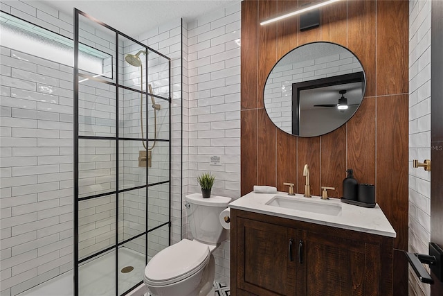 66 Randolph Dr, Palm Coast, FL 32164 - bathroom with a shower stall, vanity, a ceiling fan, and tile walls