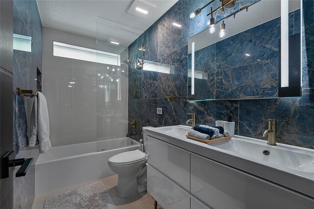 66 Randolph Dr, Palm Coast, FL 32164 - bathroom featuring double vanity, bathtub / shower combination, and tile walls