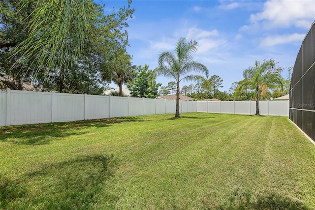 66 Randolph Dr, Palm Coast, FL 32164 - fenced backyard featuring glass enclosure