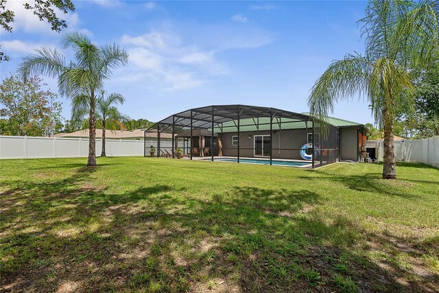 66 Randolph Dr, Palm Coast, FL 32164 - fenced backyard with glass enclosure