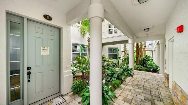 455 Riverfront Dr Unit A101, Palm Coast, FL 32137 - doorway to property with stucco siding