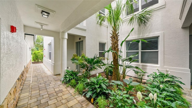 455 Riverfront Dr Unit A101, Palm Coast, FL 32137 - doorway to property with stucco siding