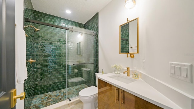 455 Riverfront Dr Unit A101, Palm Coast, FL 32137 - bathroom with vanity, a shower stall, a textured ceiling, and recessed lighting