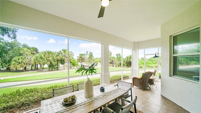 455 Riverfront Dr Unit A104, Palm Coast, FL 32137 - sunroom / solarium featuring tile patterned flooring, outdoor dining space, and a ceiling fan