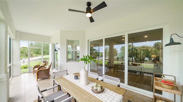 455 Riverfront Dr Unit A104, Palm Coast, FL 32137 - sunroom / solarium featuring ceiling fan, tile patterned flooring, and outdoor dining space