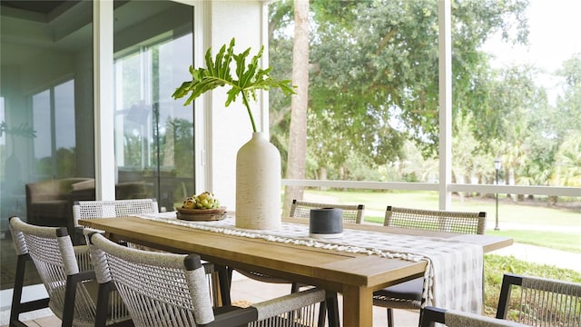 455 Riverfront Dr Unit A104, Palm Coast, FL 32137 - sunroom featuring outdoor dining space