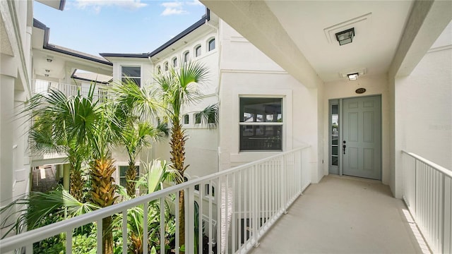 455 Riverfront Dr Unit A203, Palm Coast, FL 32137 - view of exterior entry with a balcony and stucco siding