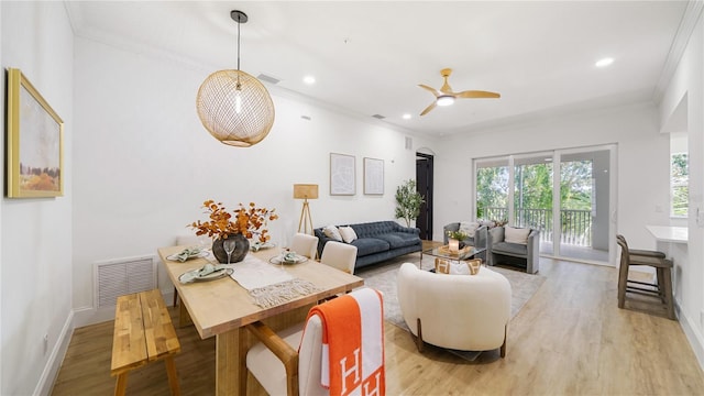 455 Riverfront Dr Unit A203, Palm Coast, FL 32137 - living area featuring healthy amount of natural light, light wood-style floors, crown molding, recessed lighting, and a ceiling fan