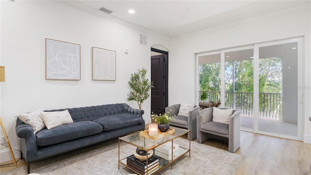 455 Riverfront Dr Unit A203, Palm Coast, FL 32137 - living room with ornamental molding, wood finished floors, arched walkways, and recessed lighting