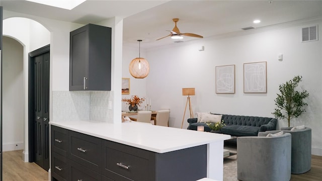 455 Riverfront Dr Unit A203, Palm Coast, FL 32137 - kitchen featuring light countertops, light wood-type flooring, ceiling fan, ornamental molding, and recessed lighting